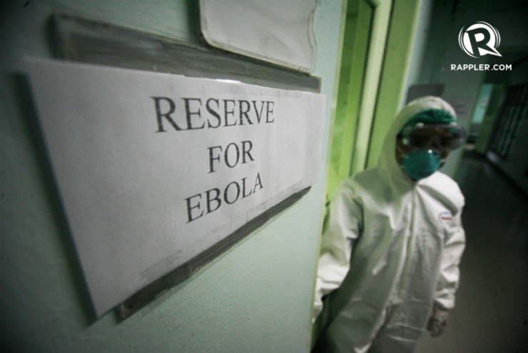 RESERVED. A nurse wearing a protective suit stands in front of the door of the isolation room reserved for possible Ebola cases in the country inside the Lung Center of the Philippines in Quezon City. File photo by Ben Nabong/Rappler