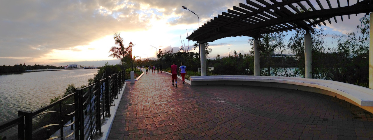 AT SUNSET. The riverside Esplanade is a popular spot for locals to walk or jog.