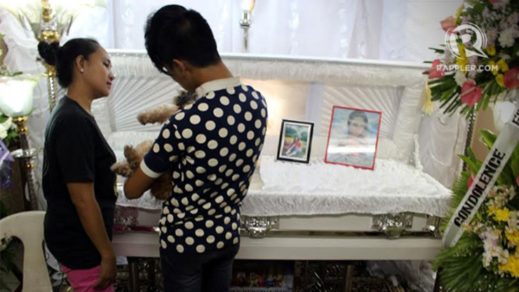 A WAKE FOR 'GANDA.' Friends of Jeffrey “Jennifer” Laude, the 26-year-old transgender who was killed by a foreigner in Olongapo, look at his coffin during his wake in Olongapo City yesterday. Photo by Jose Del/Rappler
