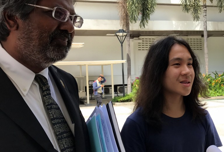AMOS YEE. Singapore rebel teen Amos Yee, who is out on bail, speaks to reporters outside the State Courts after he was jailed for six weeks for insulting Muslims and Christians in a fresh brush with the law, in Singapore on September 29, 2016. File photo by Elizabeth Law/AFP 