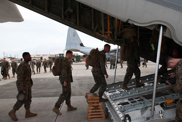 TO TACLOBAN. In this file photo, members of the US Marine Corps board a KC-130J Hercules aircraft on November 10, 2013 at Marine Corps Air Station Futenma, Okinawa, Japan, moments before departing for a humanitarian assistance and disaster relief mission to the Philippines. Photo by US Marine Corps/AFP