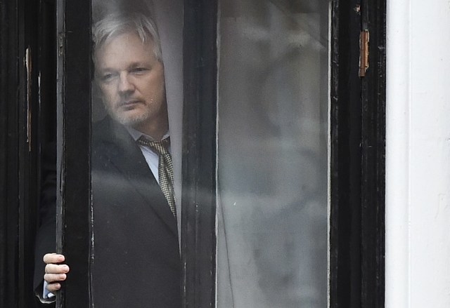 ASSANGE. This file photo taken on February 05, 2016 shows WikiLeaks founder Julian Assange coming out on the balcony of the Ecuadorian embassy to address the media in central London. File photo by Ben Stansall/AFP 