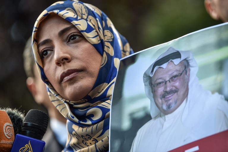 KILLED. Photographed is Nobel Peace Prize laureate Yemeni Tawakkol Karman with a picture of Khashoggi during a demonstration. File photo by Ozam Kose/AFP 
