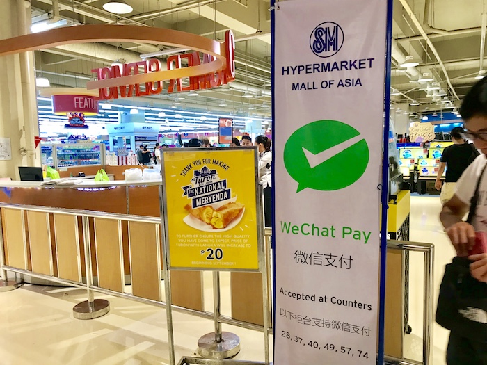 EASY SHOPPING. Popular messaging and online payments app WeChat is available for Chinese customers in SM Mall of Asia. Photo by Ralf Rivas/Rappler  