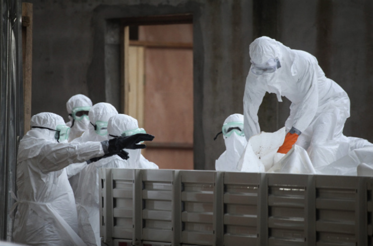 OUTBREAK.A picture made available August 2, 2014 shows Liberian nurses in protective clothing preparing several bodies of victims of Ebola for burial in the isolation unit of the ELWA Hospital in Monrovia, Liberia, August 1. File photo by Ahmed Jallanzo/EPA