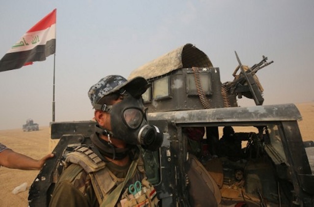 MOSUL CAMPAIGN. Iraqi forces gather in the al-Shura area, south of Mosul, on October 24, 2016, during an operation to retake the main hub city from the Islamic State group jihadists. Photo by Ahmad Al-Rubaye/AFP 