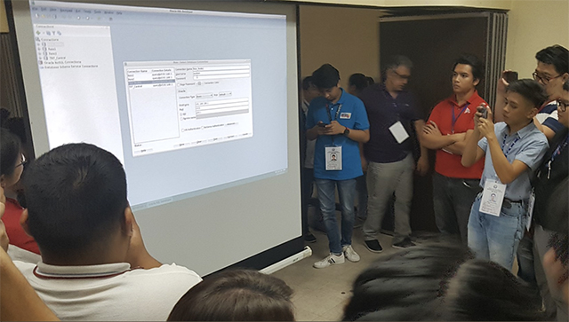 SERVER GLITCH. Representatives of media, watchdog groups and political parties observe as Comelec and Smartmatic debug the Transparency server.  