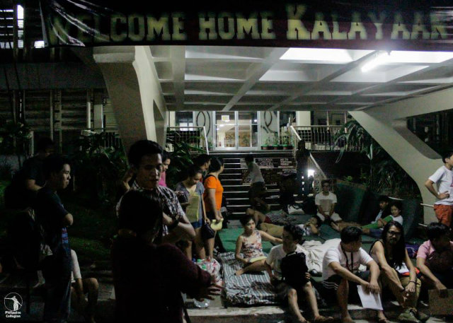 HOMELESS. UP students camp out in front of the Kalayaan Residence Hall, while waiting for the results of their appeals for dorm applications. Photo from the UP Philippine Collegian UP Collegian