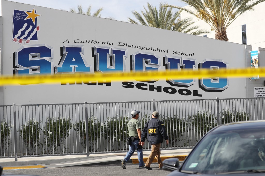 ANOTHER SHOOTING. FBI personnel walk at Saugus High School after a shooting at the school left two students dead and three wounded on November 14, 2019 in Santa Clarita, California. Mario Tama/Getty Images/AFP 