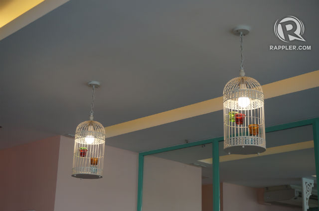 NO BIRDS, JUST LIGHTS. Cute birdcage lamps adorn the place