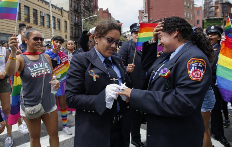 PRIDE MARCH PROPOSAL. Trudy Bermudez and paramedic Tayreen Bonilla of New York City Fire Department get engaged at the annual Pride Parade on June 24, 2018 in New York City. Photo by Kena Betancur/Getty Images/AFP 