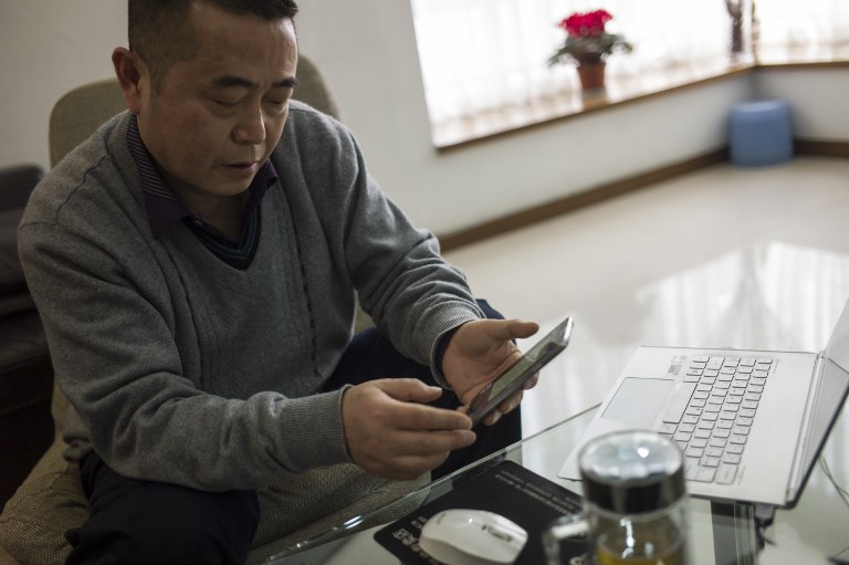 DISSIDENT. In a picture taken on January 22, 2015, Chinese dissident Huang Qi poses in his apartment in Chengdu, Sichuan province. Photo by Fred Dufour/AFP 
 
