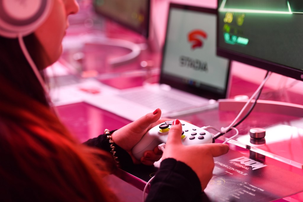 GOOGLE STADIA. A visitor plays a cloud-game at the stand of Google Stadia during the Video games trade fair Gamescom in Cologne, western Germany, on August 21, 2019. File photo by Ina Fassbender/AFP 
