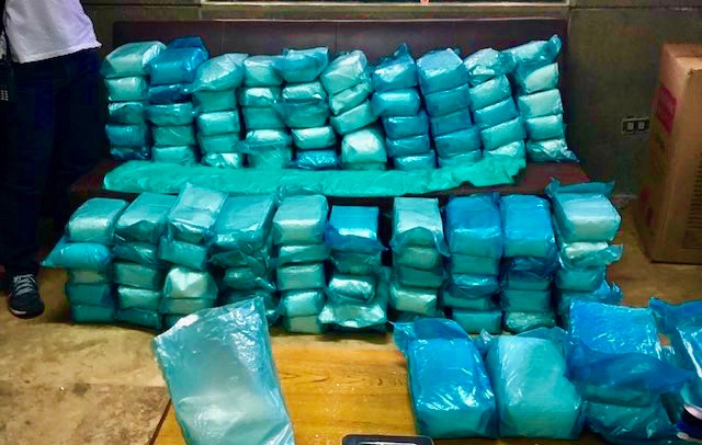 BIG HAUL. Police and Philippine Drug Enforcement Agency operatives seize packs of suspected shabu from a warehouse in Tanza, Cavite. PNP photo 