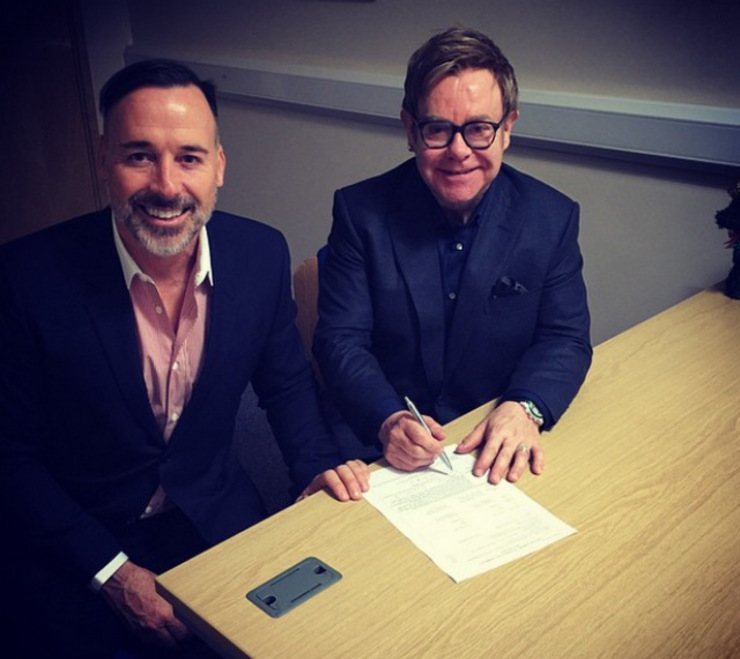 JUST MARRIED. Singer Elton John and partner David Furnish signing their marriage contract. The two tied the knot in Windsor. Photo from Instagram/@eltonjohn