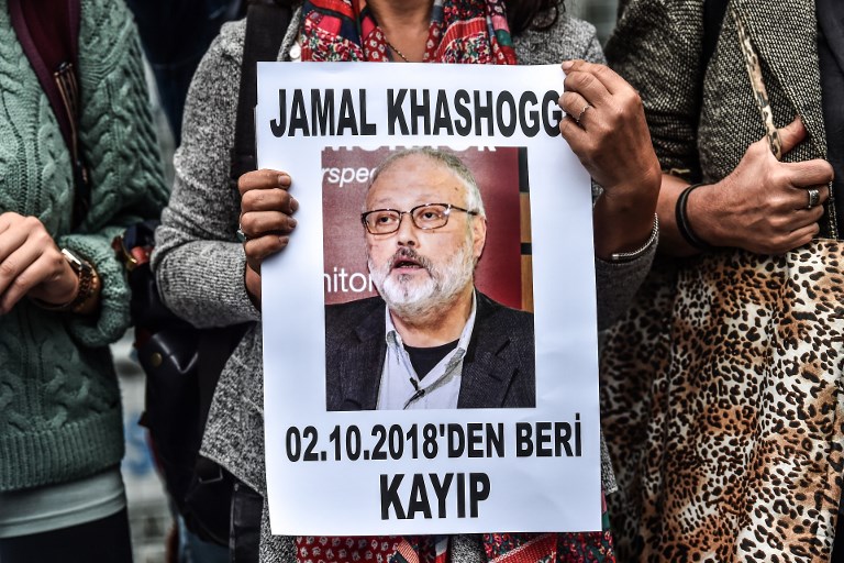 PROTEST. A woman holds a portrait of slain journalist and Riyadh critic Jamal Khashoggi. File photo by Ozan Kose/AFP 