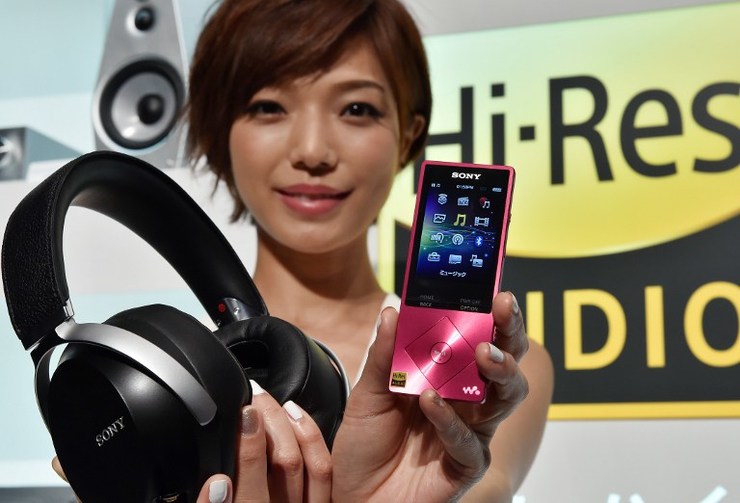 A model displays Japanese electronics giant Sony's portable digital audio player 'Walkman A series' which is designed to play the quality of compact disc (CD) audio, so called "High-Resolution Audio" in Tokyo on September 25, 2014. Yoshikazu Tsuno/AFP