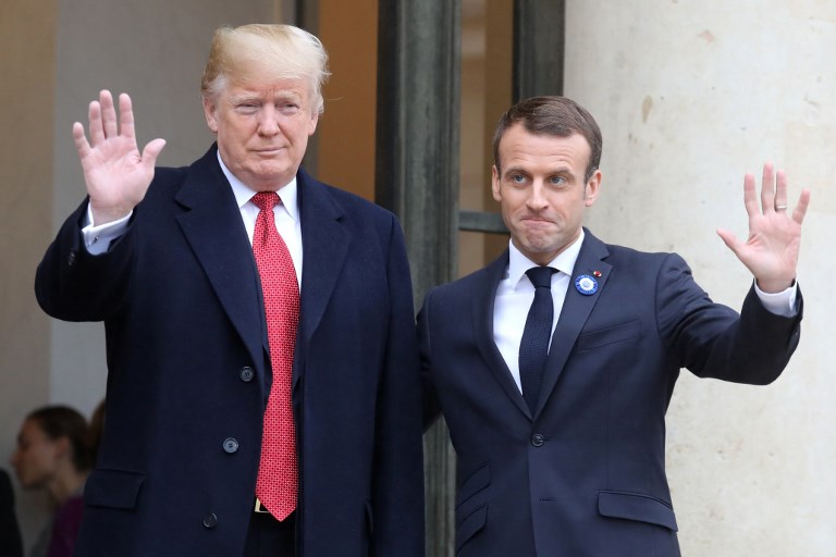 MISINTERPRETED? US President Donald Trump (L) is welcomed by French President Emmanuel Macron as he arrives for bilateral talks at the Elysee Palace in Paris on November 10, 2018 on the sidelines of commemorations marking the 100th anniversary of the 11 November 1918 armistice, ending World War I. Photo by ludovic Marin/AFP 