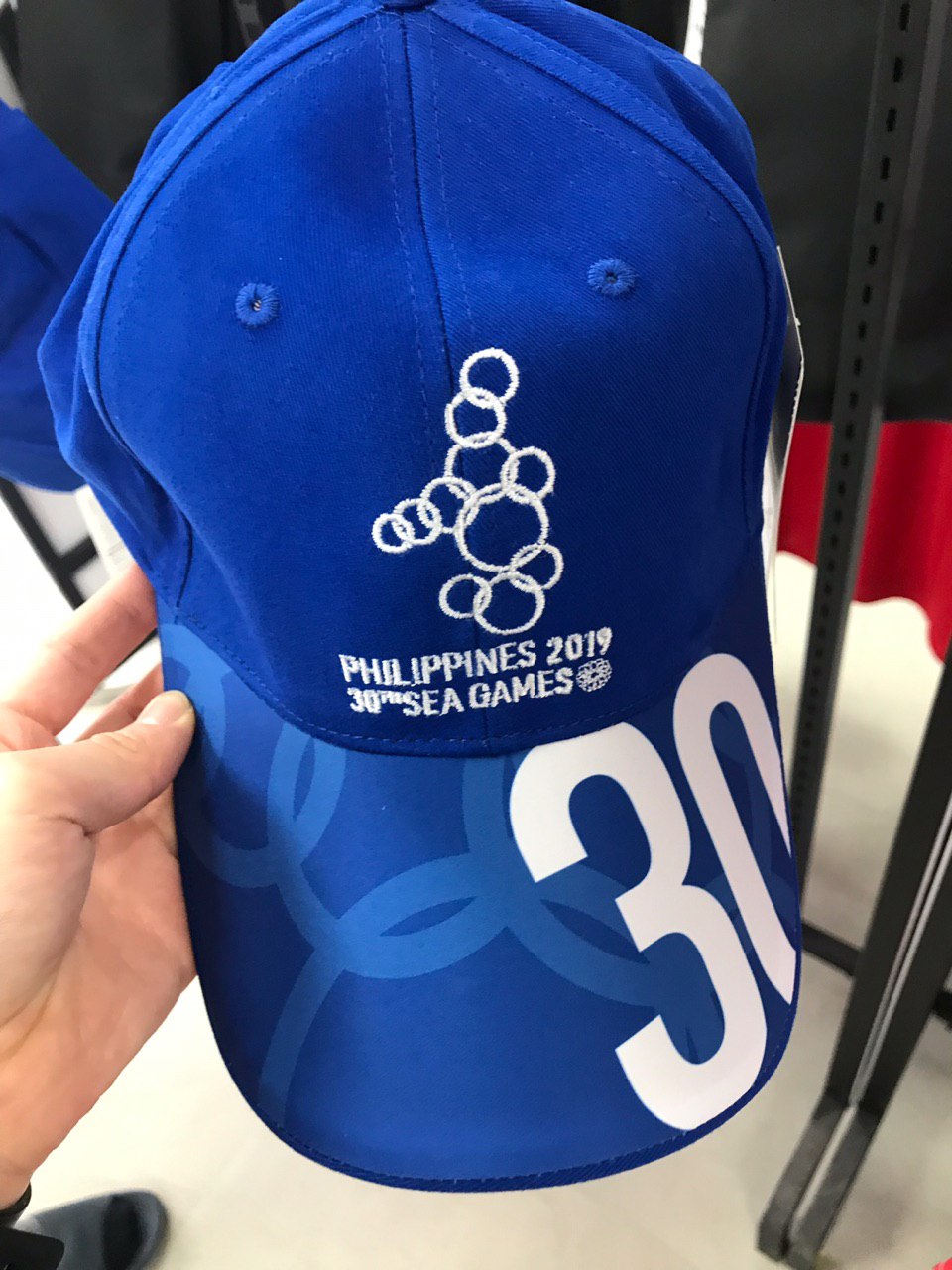 HEADWEAR. The blue 2019 SEA Games FBT cap costs P949. Photo by Beatrice Go/Rappler 