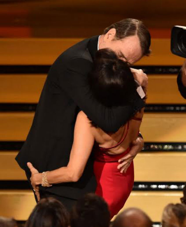 A BIG KISS. Actor Bryan Cranston gives 'Veep' actress Julia Louis-Dreyfus a kiss during the 2014 Emmys. Photo by Kevin Winter/Getty Images/AFP