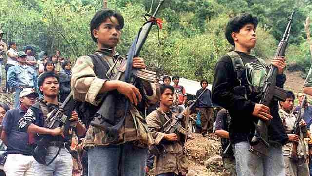 PEACE TALKS SOON?. Picture dated March 29, 2002 shows NPA guerrillas at a clandestine assembly in the Cordillera region in northern Philippines. File photo by Agence France-Presse 