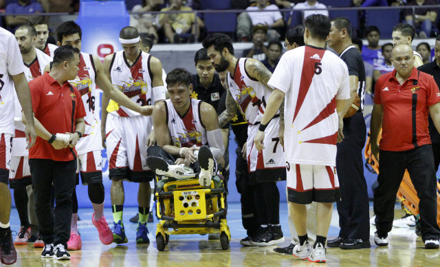 BIG LOSS. Reigning MVP June Mar Fajardo gets stretchered off the court. Photo by PBA Images 