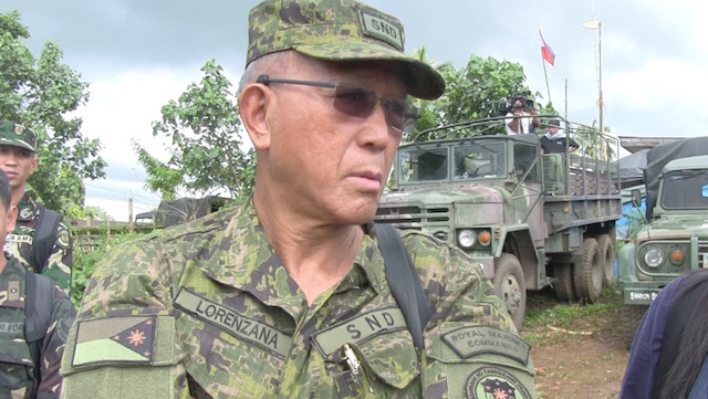COMBAT ZONE. Defense Secretary Delfin Lorenzana wears the Philippine Army's new battle dress attire. Rappler photo 