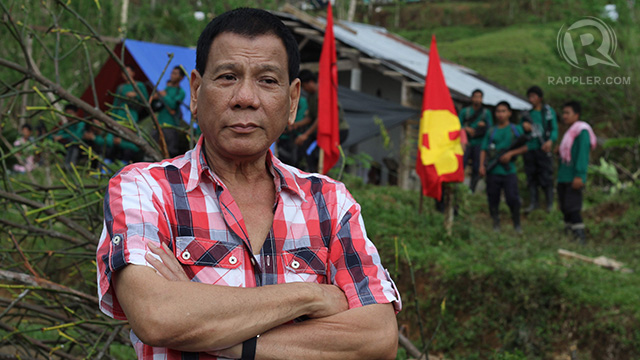 'LEFTIST.' Rodrigo Duterte poses in front of an NPA camp in Compostela Valley. Photo by Karlos Manlupig 