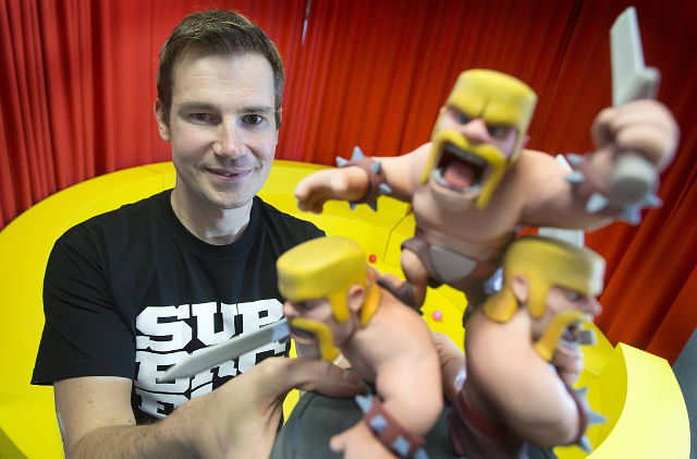 SUPERCELL. Finnish game developer Supercell's creative director Mikko Kodisoja holds up figurines of 'The Barbarian', a character of Supercell's top-selling game 'Clash of Clans', in Helsinki, Finland, October 17, 2013. File Photo by Mauri Ratilainen/EPA 