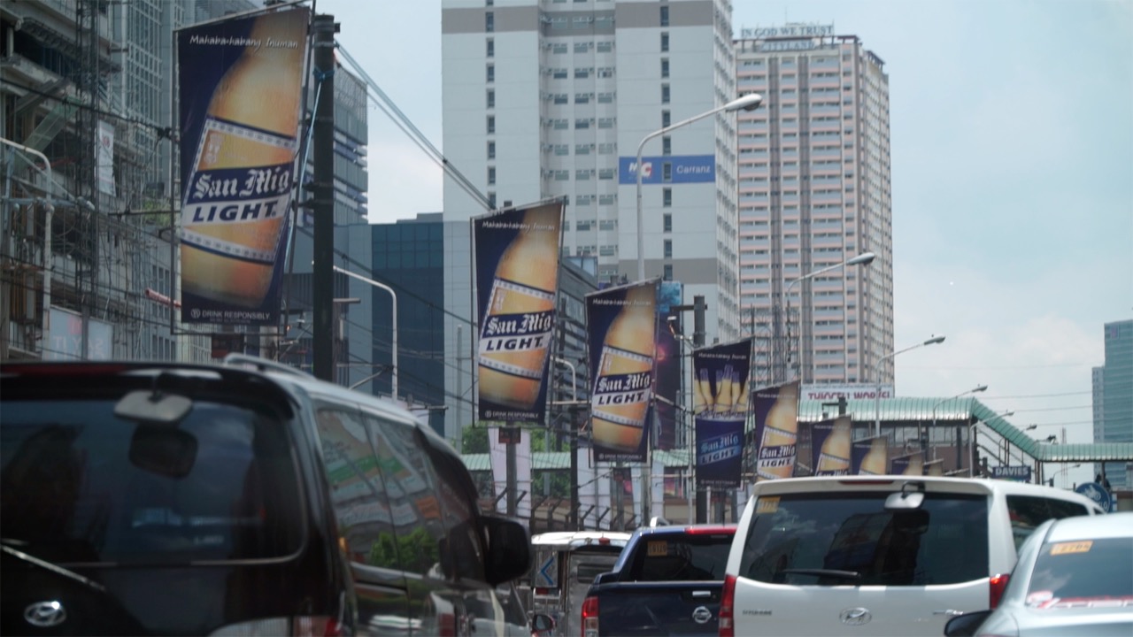 SALES. Billboards entice commuters and drivers to buy their products. Photo by Naoki Mengua/Rappler 