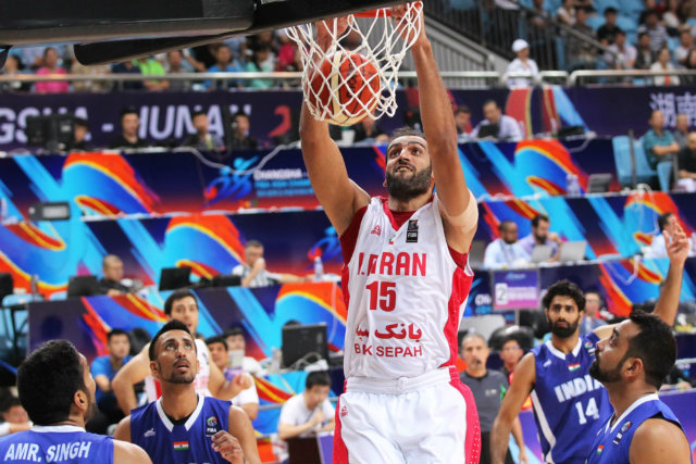 Hamed Haddadi of Iran throws down a jam against India. Photo from FIBA.com 