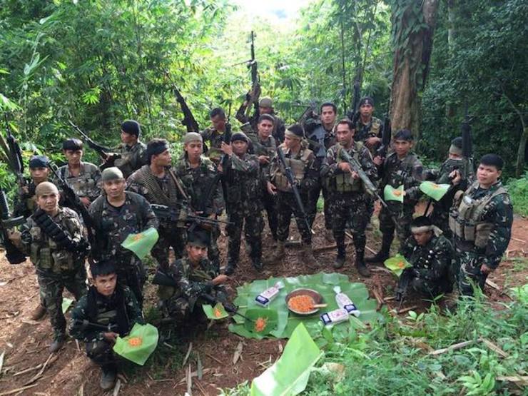 NOCHE BUENA: Troops in the jungles of Sulu feast on a modest Noche Buena. Photo courtesy of AFP-PAO