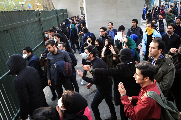 OUTNUMBERED. Iranian students protest at the University of Tehran during a demonstration driven by anger over economic problems, in the capital Tehran on December 30, 2017. Photo from Stringer / AFP 