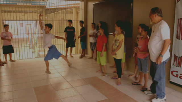CONFIDENCE. A street kid turned ballet dancer shows off his dance moves in one of the halls of Tuloy sa Don Bosco Foundation. All photos by Franz Lopez/ Rappler  