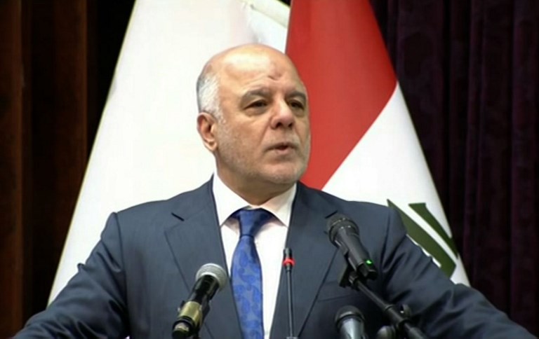 IRAQ PM. An image grab taken from Iraqiya state TV channel shows Iraqi Prime Minister Haider al-Abadi delivering a televised speech in Baghdad on December 9, 2017, announcing the end of a war by Iraqi forces to drive the Islamic State group out of the country. Handout by Iraqiya TV/AFP 