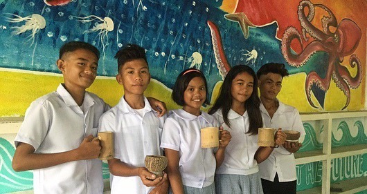 ENVIRONMENT-FRIENDLY. Students of Bulata National High School use mugs made from indigenous materials to reduce plastic waste. Photo courtesy of PRRCFI 