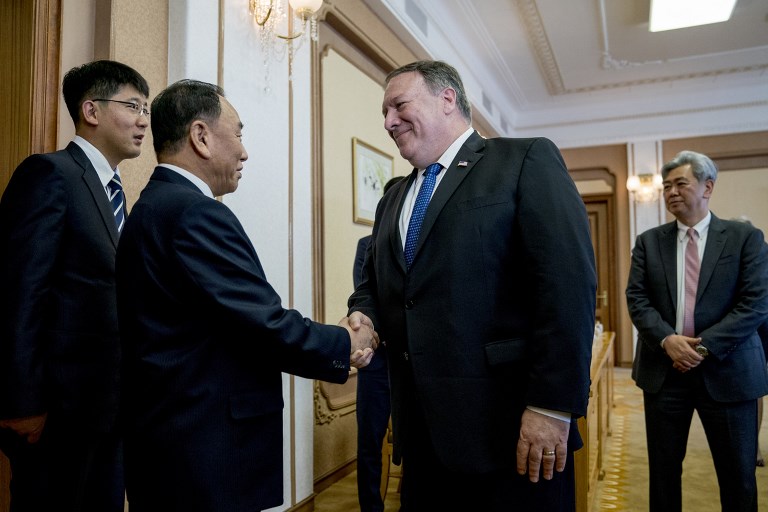 DELAYED TALKS. US Secretary of State Mike Pompeo (2nd R) greets North Korea's director of the United Front Department, Kim Yong Chol (2nd L) as they arrive for a meeting at the Park Hwa Guest House in Pyongyang on July 6, 2018. Photo by Andrew Harnik/AFP 
