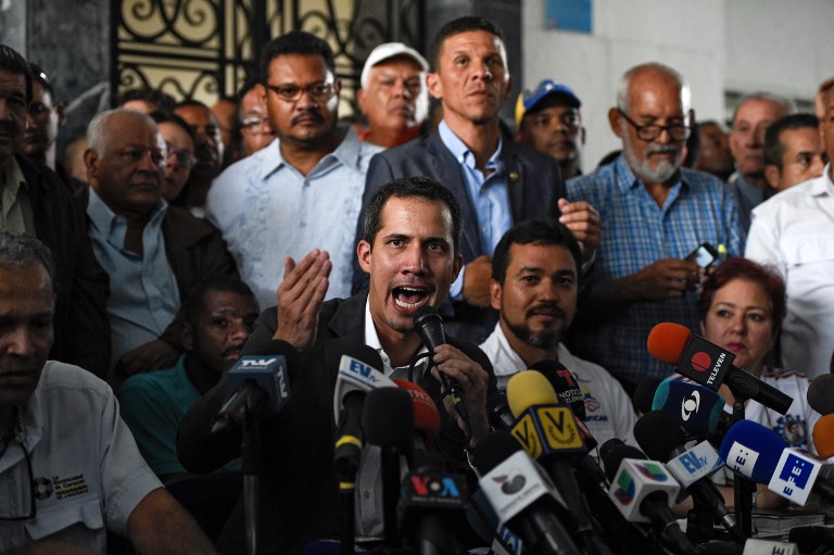 KID. Venezuelan opposition leader and self-proclaimed acting president Juan Guaido (center) speaks during a press conference after a meeting with union leaders in Caracas on March 5, 2019. Photo by Federico Parra/AFP 