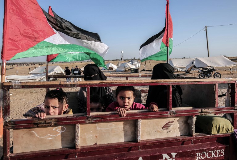 TENT PROTEST. Palestinians gather at the site of a tent protest on April 8, 2018, on the Israel-Gaza border east of Rafah in the southern Gaza Strip. File photo by Said Khatib/AFP 