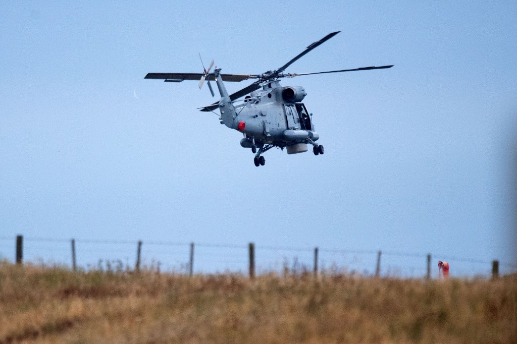 DARING MISSION. An air force helicopter leaves Whakatane airport on December 13 as it assists with the recovery of the 8 bodies on White Island who perished in the December the 9th White Island eruption, in New Zealand. Photo Marty Melville/AFP  