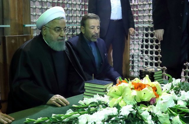 HASSAN ROUHANI. A handout picture released by the Iranian president's official website on January 31, 2018 shows Iran's President Hassan Rouhani (L), praying over the tomb of the founder of Iran's Islamic Republic Ayatollah Ruhollah Khomeini, at the latter's shrine in southern Tehran. File photo by Iranian Presidency/AFP 