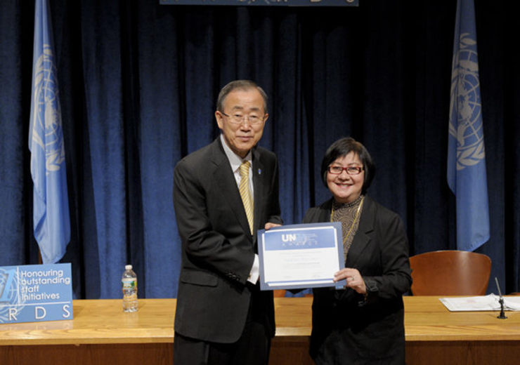WORK RECOGNIZED. Information officer Natalyn Bornales receives the 2012 UN 21 Awards from UN chief Ban Ki-Moon for her team’s work in digitizing UN transcripts, tapes and information. UN Photo 