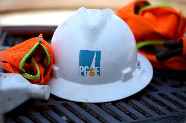 PG&E. The Pacific Gas and Electric (PG&E) logo is displayed on a hard hat at a work site on July 30, 2014 in San Francisco, California. File photo by Justin Sullivan/Getty Images/AFP 