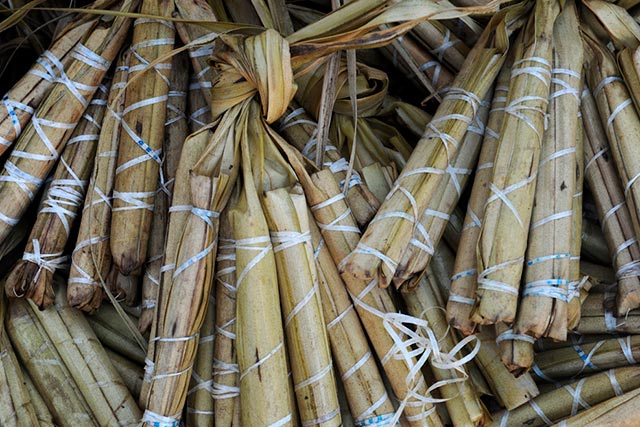 SUMAN. Sticky rice cooked in coconut milk and wrapped in palm fronds.