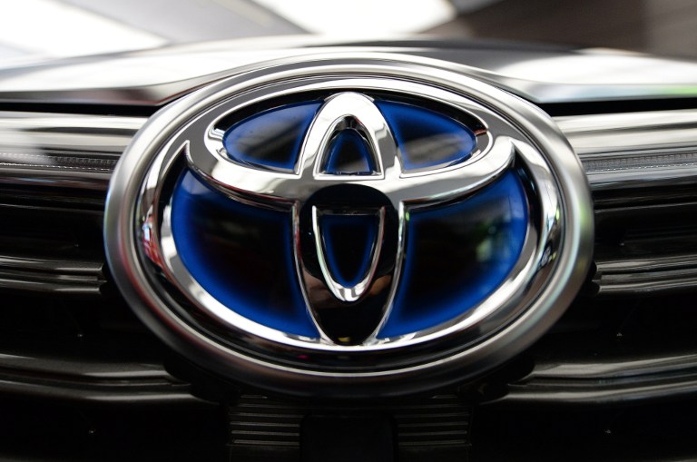 A Toyota Motors logo, shown on its vehicle 'SAI', at its headquarters in Tokyo on August 5, 2014. Toshifumi Kitamura/AFP 