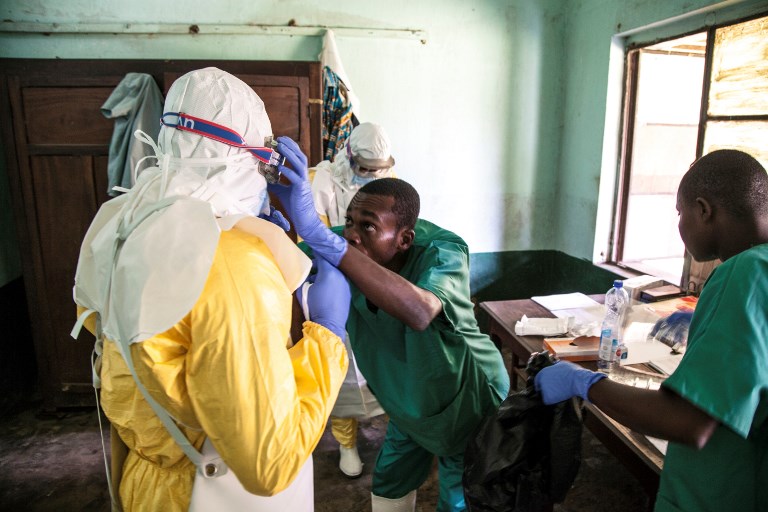 CONTAINED. In this handout photograph released by UNICEF health workers wear protective equipment as they prepare to attend to suspected Ebola patients at Bikoro Hospital. Photo by Mark Naftalin/UNICEF/AFP  