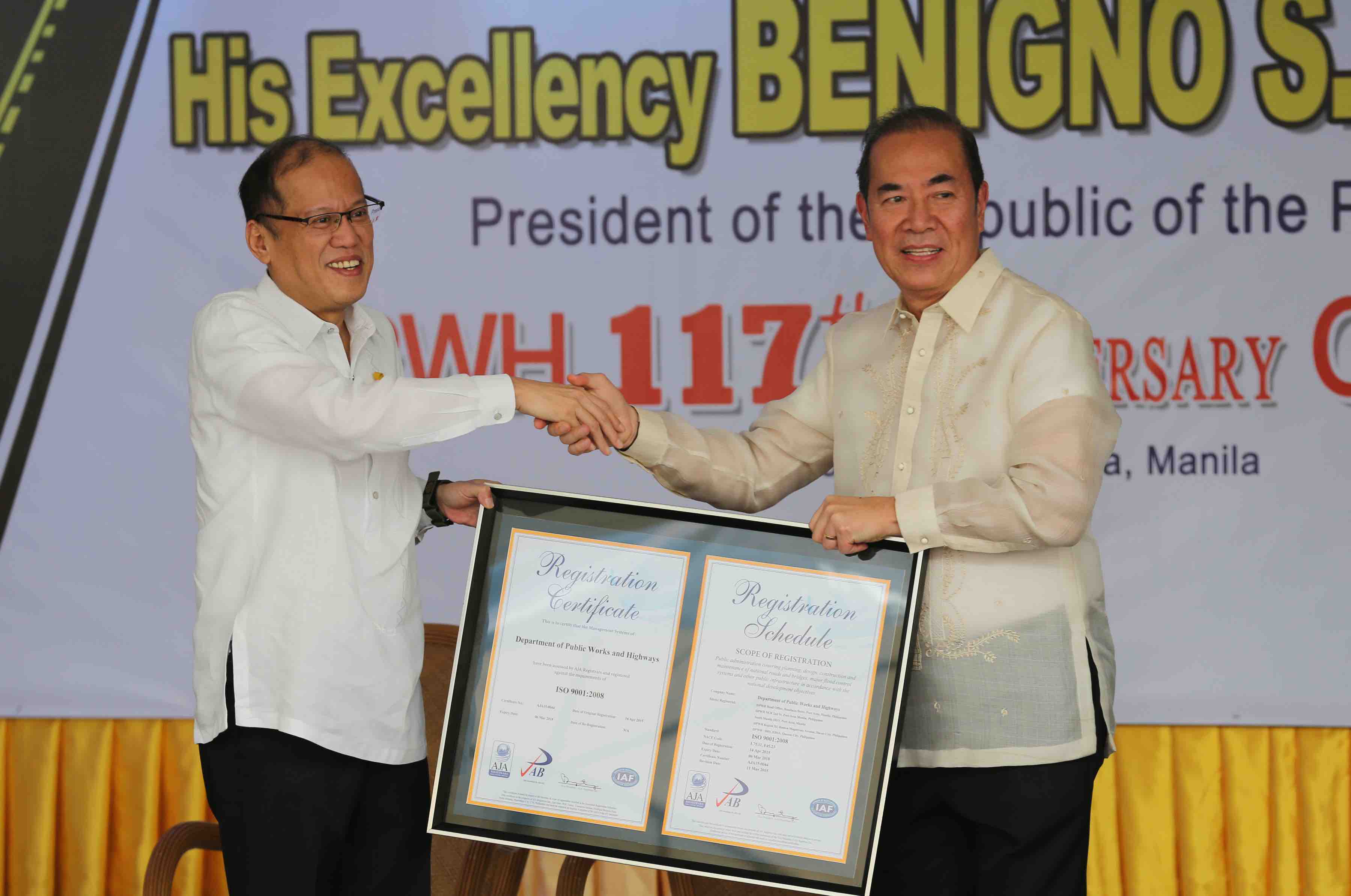 President Benigno S. Aquino III receives a copy of a framed ISO 9001:2008 Registration Certificate of DPWH’s Quality Management System (QMS) presented by Public Works and Highways Secretary Rogelio Singson during the 117th anniversary of the Department of Public Works and Highways (DPWH) at the DPWH Quadrangle of the Central Office in Bonifacio Drive Port Area, Manila City on Monday (June 22, 2015). This year’s theme: “DPWH: Sa Daang Matuwid, Para Sa Diyos at Bayan”. (Photo by Lauro Montellano, Jr. / Malacañang Photo Bureau) 