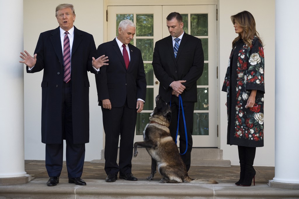 CELEBRITY. In this file photo taken on November 25, 2019, US President Donald Trump, Vice President Mike Pence and First Lady Melania Trump stand with Conan, the military dog that was involved with the death of ISIS leader Abu Bakr al-Baghdadi, at the White House in Washington, DC. Photo by Jim Watson/AFP 