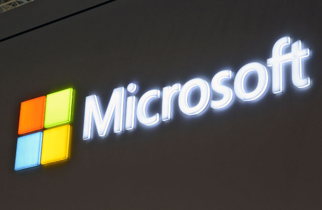 MICROSOFT. A file image dated March 5, 2013 showing the Microsoft logo at Microsoft stand at the CeBit trade fair, Hanover, Germany. File Photo by Mauritz Antin/EPA 
