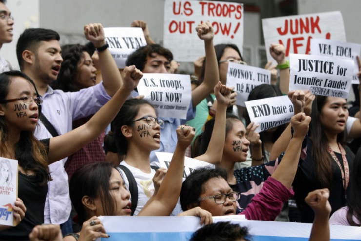 SCRAP VFA. Protestors at the University of the Philippines call for the scrapping of the Visiting Forces Agreement after a US Marine allegedly murdered a transgender woman in Olongapo City. Photo by Ben Nabong/Rappler